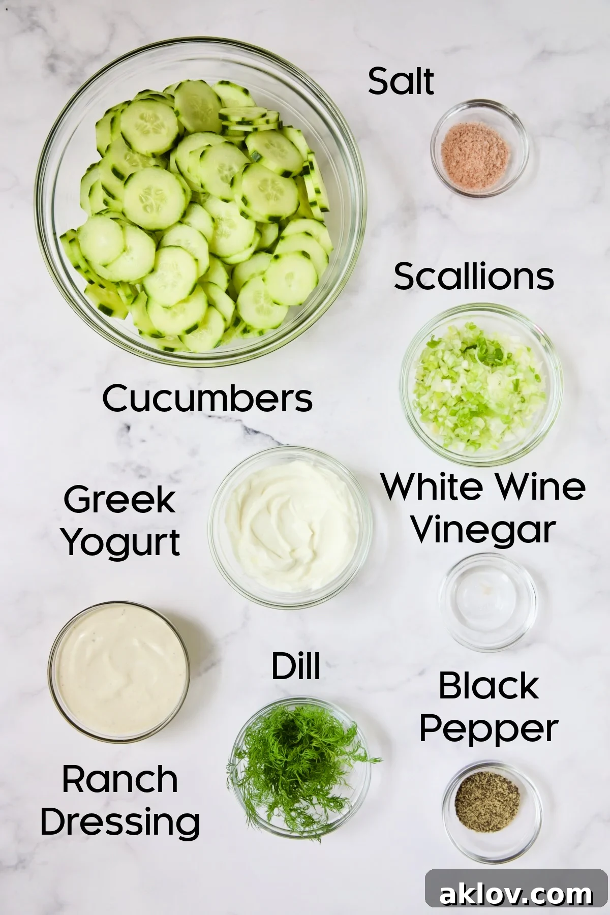 Ingredients for Yogurt Ranch Cucumber Salad in glass bowls.