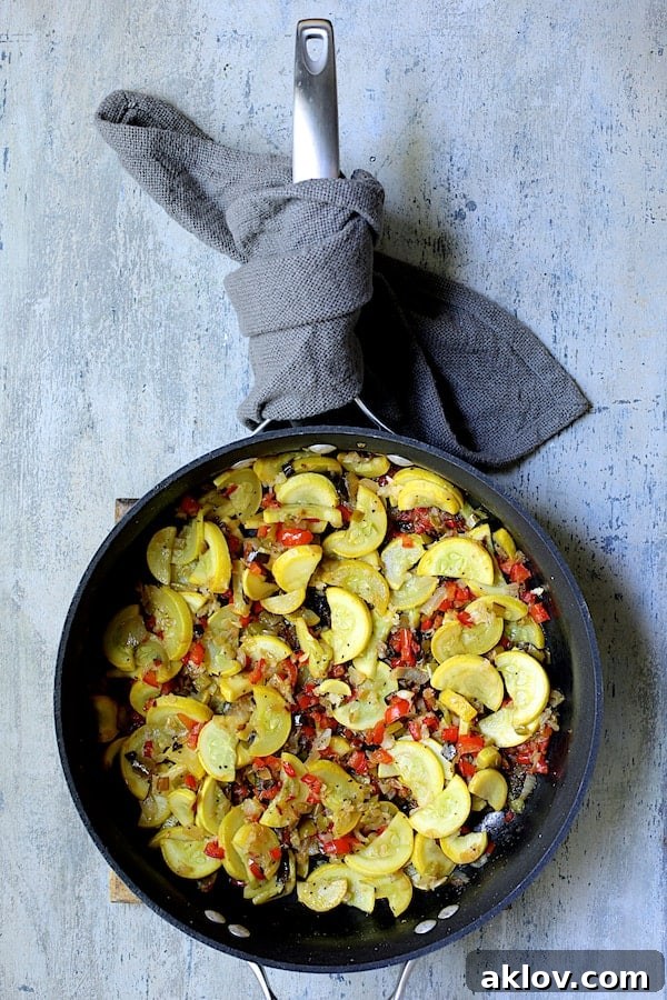 Photo of sauteed yellow squash in skillet.