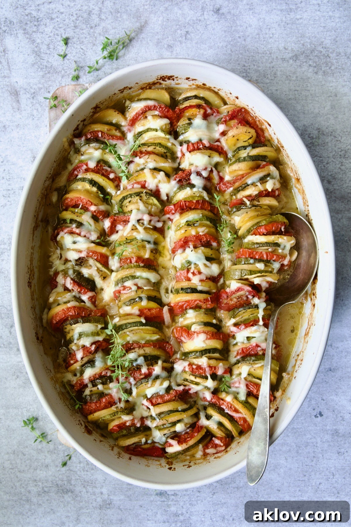 Baked Vegetable Tian with melted cheese on top.