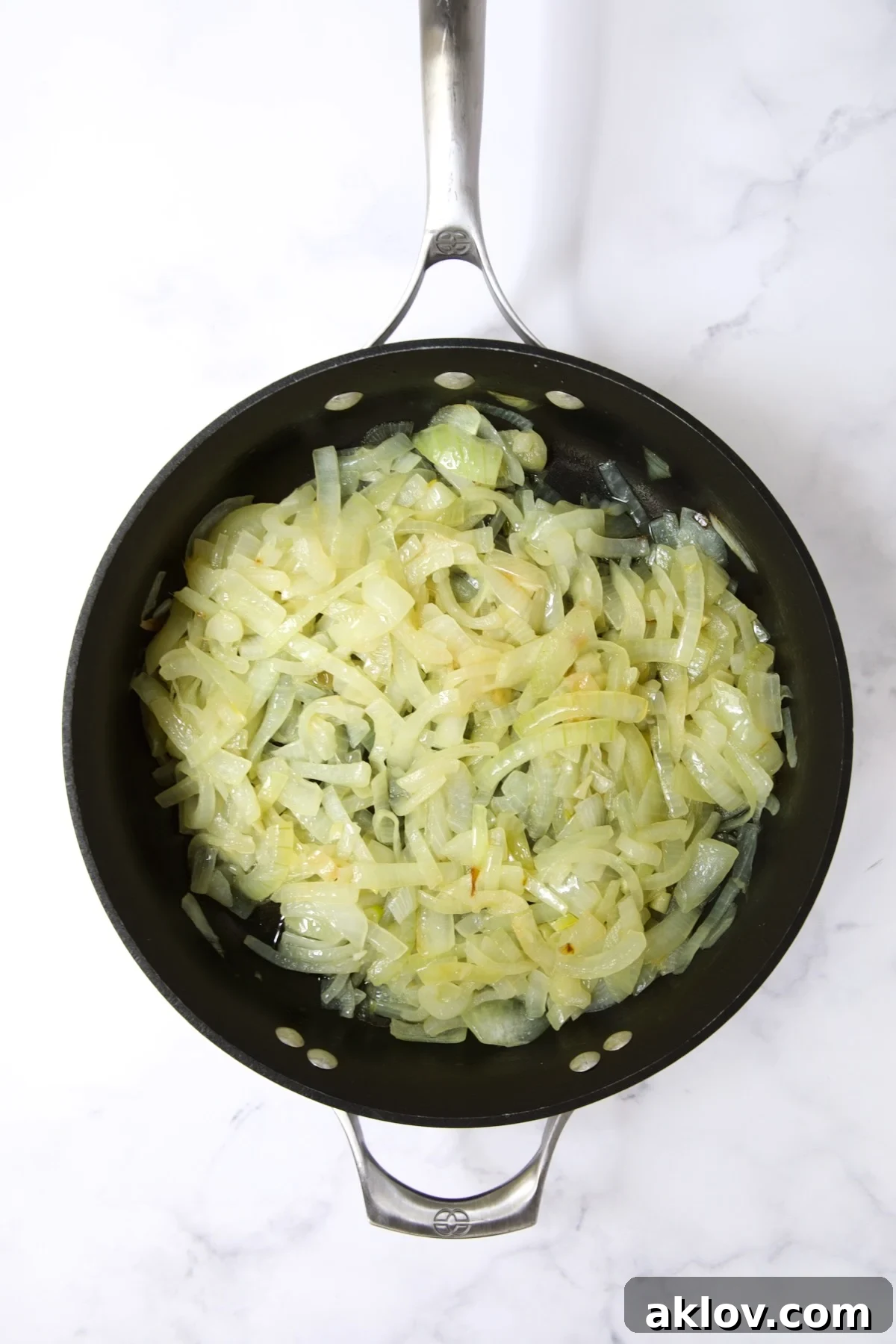 Cooked onions in a nonstick skillet, softened and lightly browned.