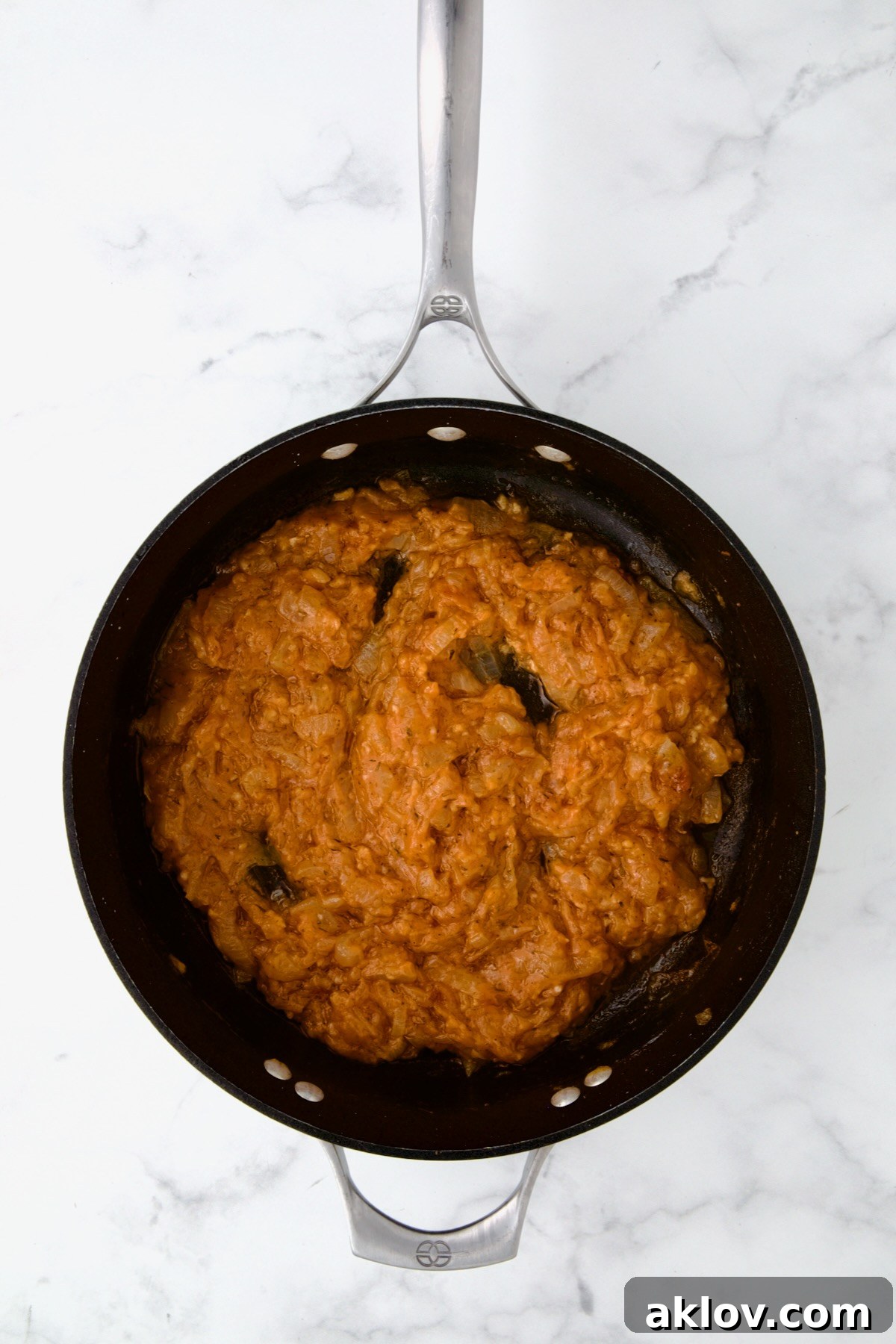 Golden Turkey Meatballs with Ale Glaze 14 Onions, tomato paste and flour in nonstick skillet.