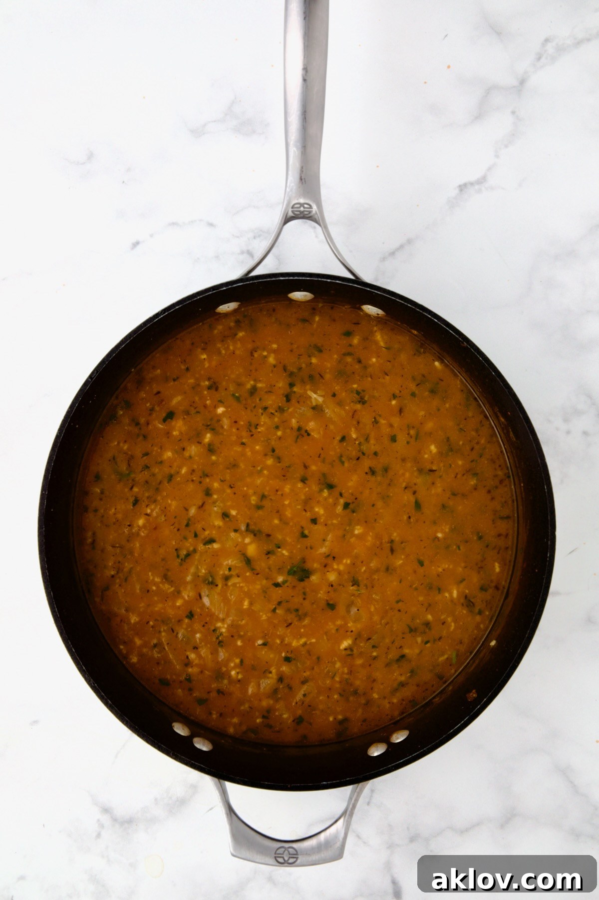 Golden Turkey Meatballs with Ale Glaze 16 Broth and herbs added to beer, onion and tomato paste in nonstick skillet.