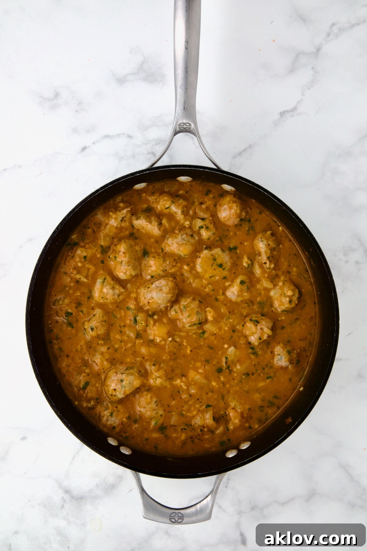 Golden Turkey Meatballs with Ale Glaze 17 Meatballs added back to sauce in nonstick skillet.