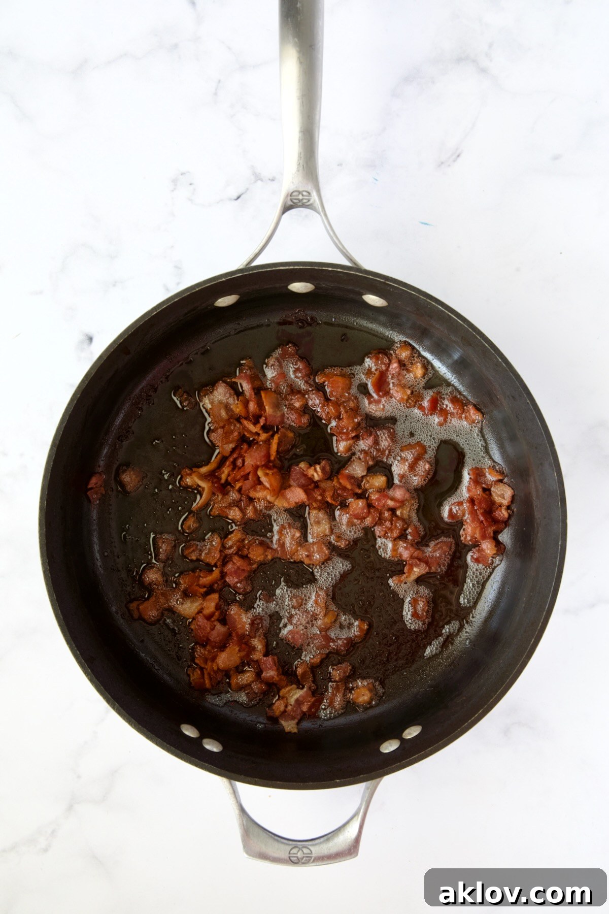 Cooked crispy bacon in nonstick skillet.