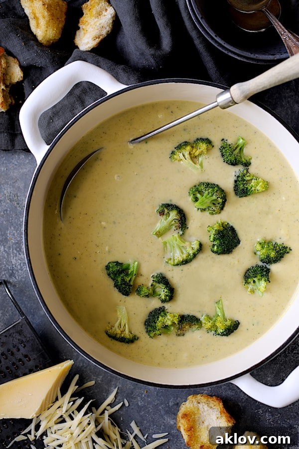 Creamy Broccoli Gruyere Soup in a white Dutch oven