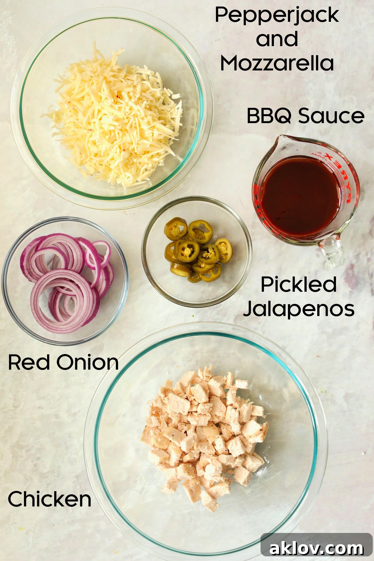 Ingredients for Cast Iron Skillet Pizza in glass bowls.