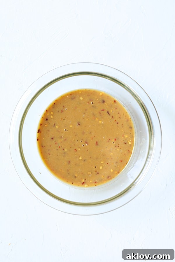 Overhead shot of sauce ingredients in glass bowl