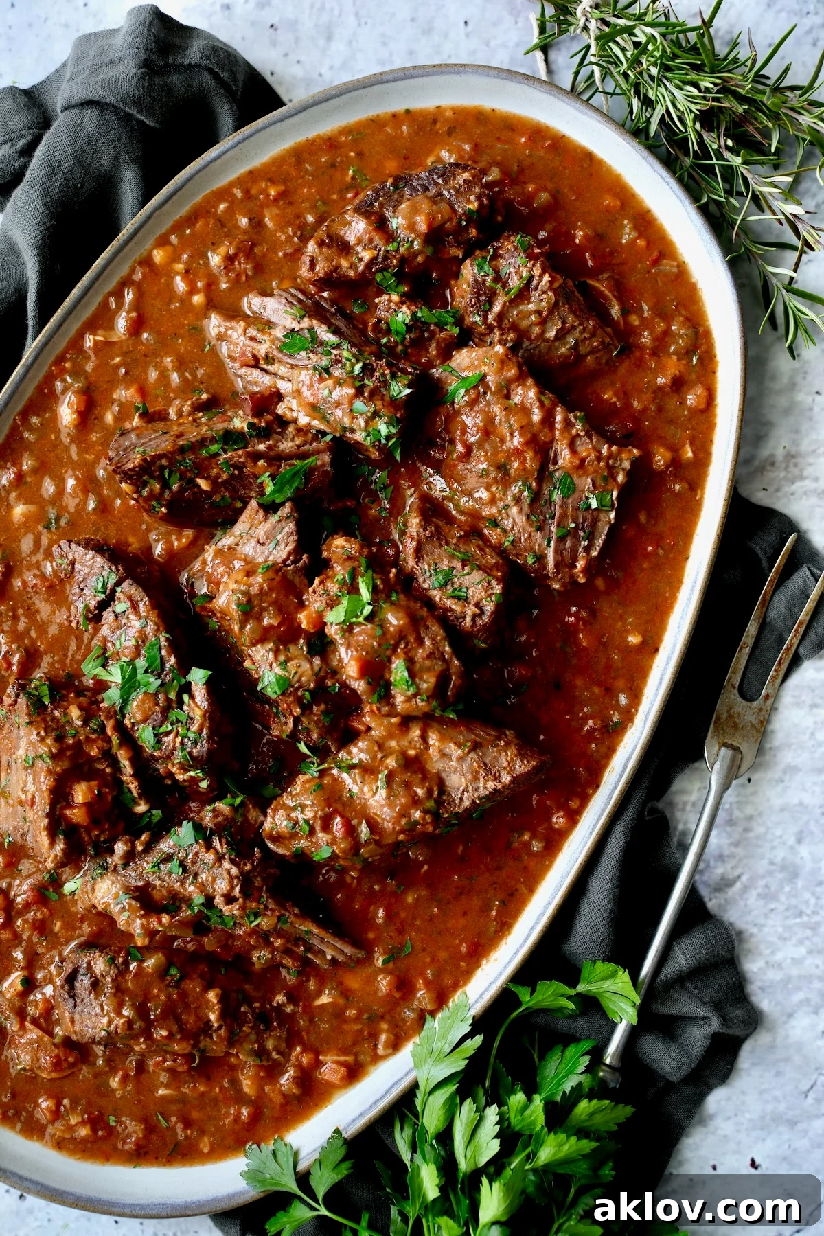 Italian Pot Roast (Stracotto) on gray-rimmed platter.
