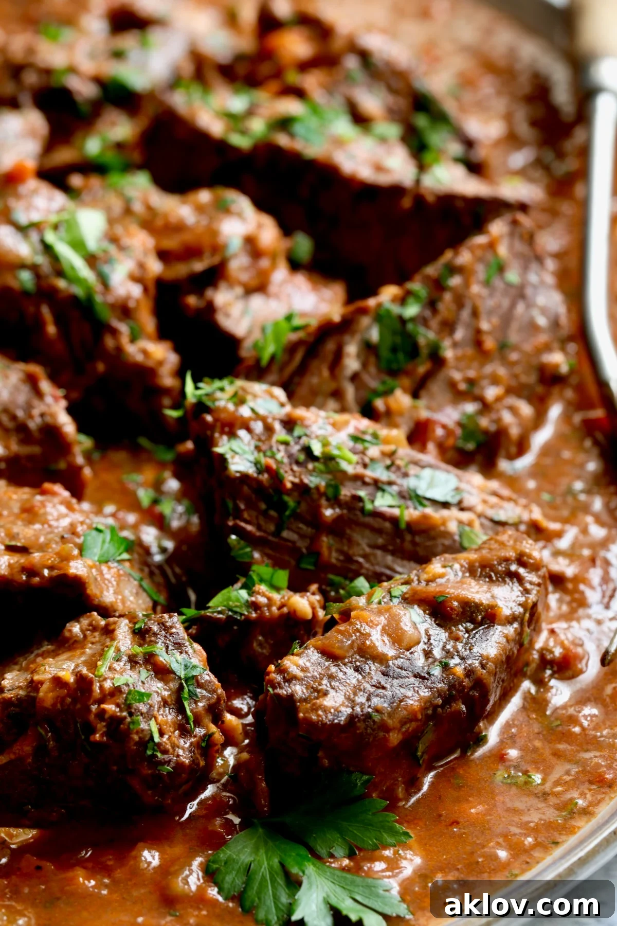 Italian Pot Roast (Stracotto) on platter with serving fork.