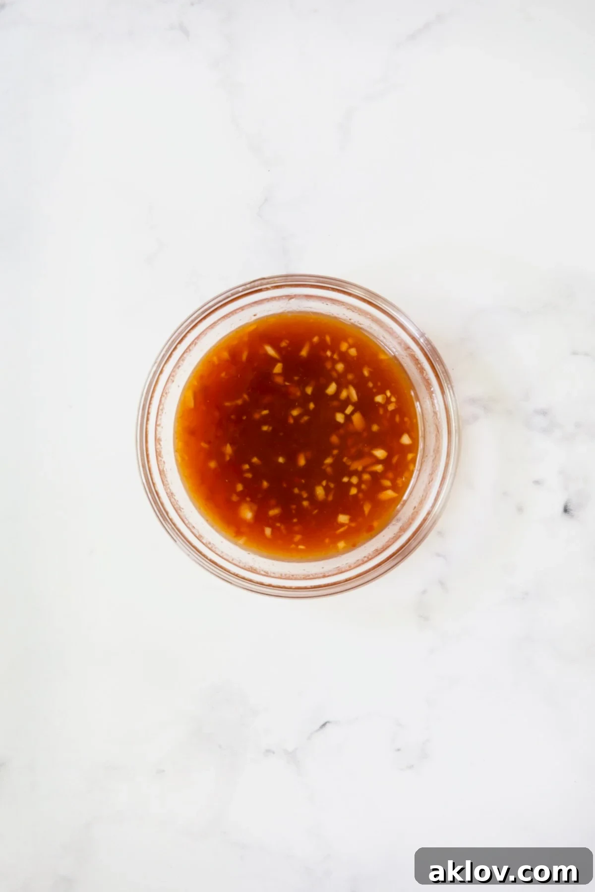 Glass bowl with sweet chili glaze.