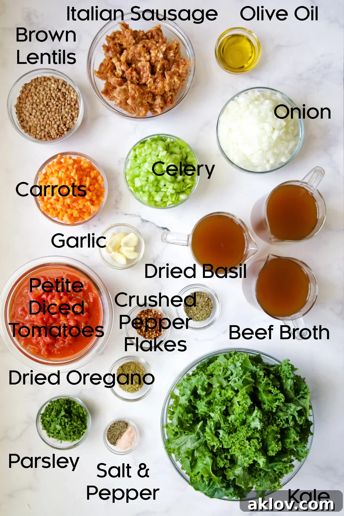 Assorted ingredients for Sausage and Lentil Soup with Kale, neatly arranged in clear glass bowls, showcasing fresh produce and pantry staples.