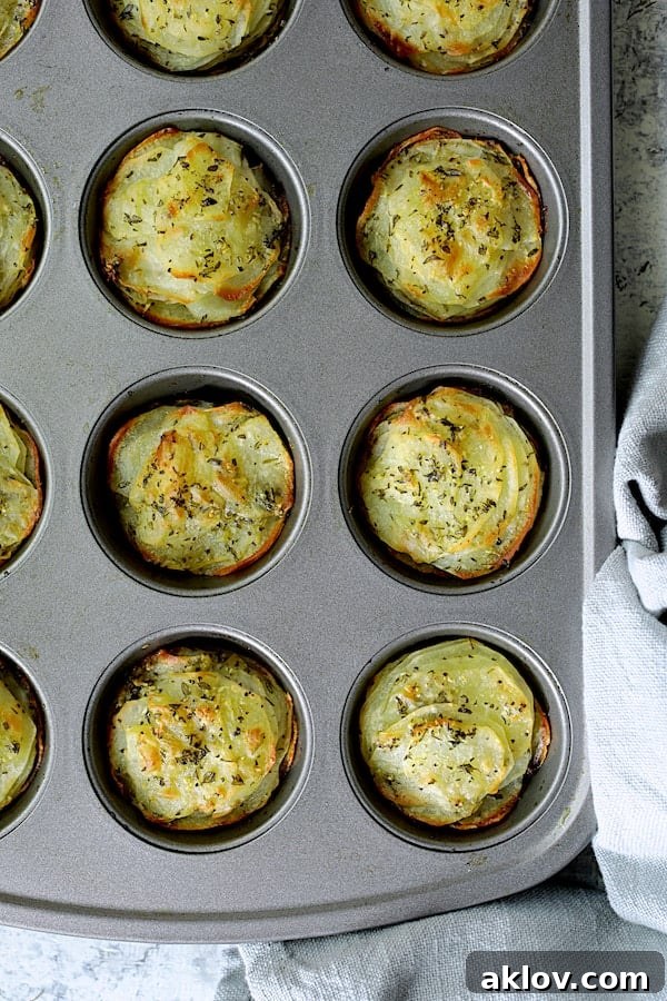 Golden Garlic Herb Potato Galettes in a Muffin Tin 8 Freshly baked Garlic Herb Muffin Pan Potato Galettes in the muffin pan, tops golden brown and edges crisp.