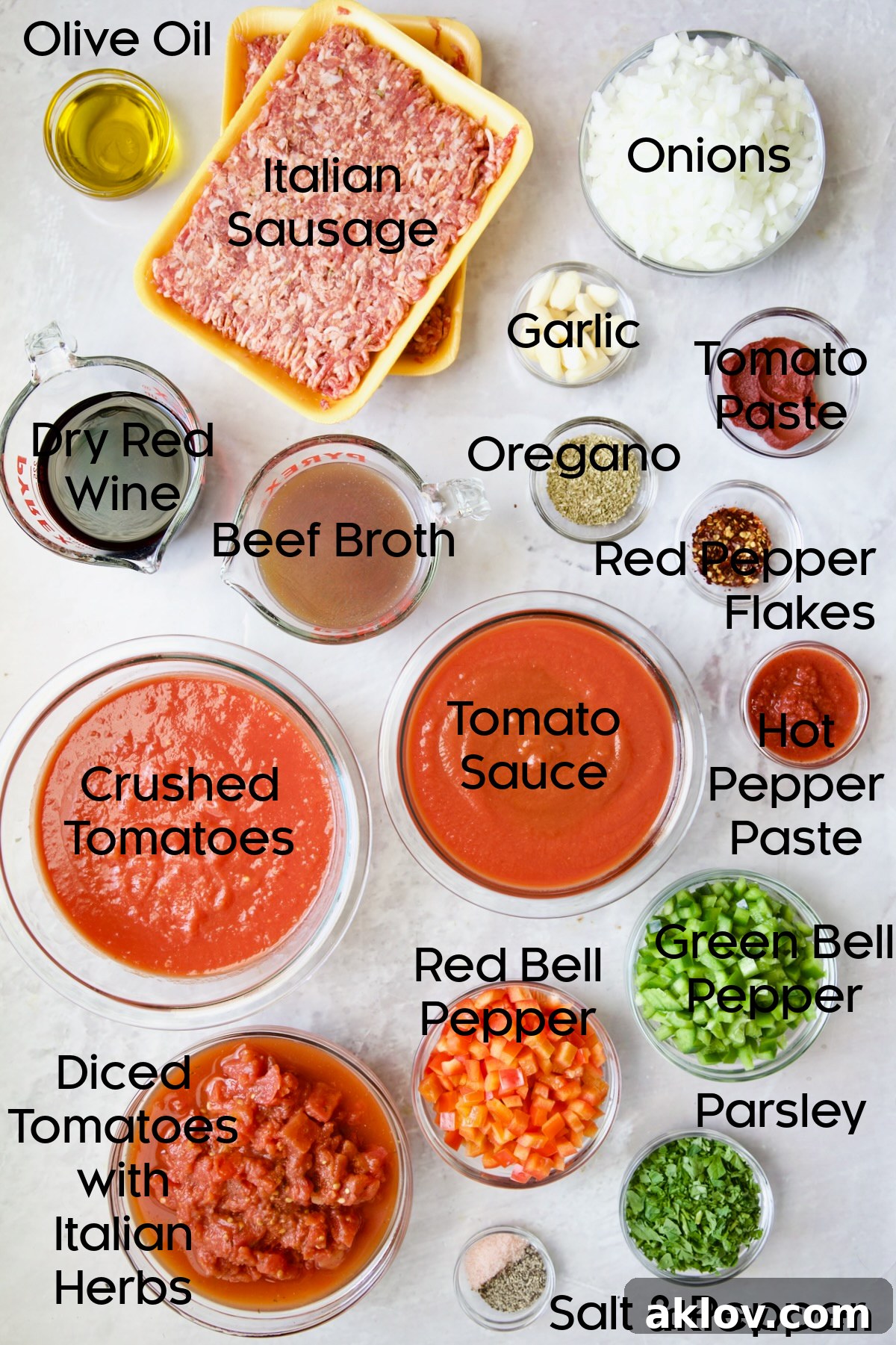 Ingredients for Slow Cooker Spicy Sausage and Pepper Ragu in glass bowls.