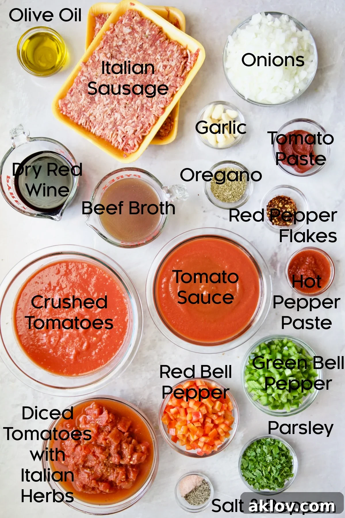 Ingredients for Slow Cooker Spicy Sausage and Pepper Ragu in glass bowls.