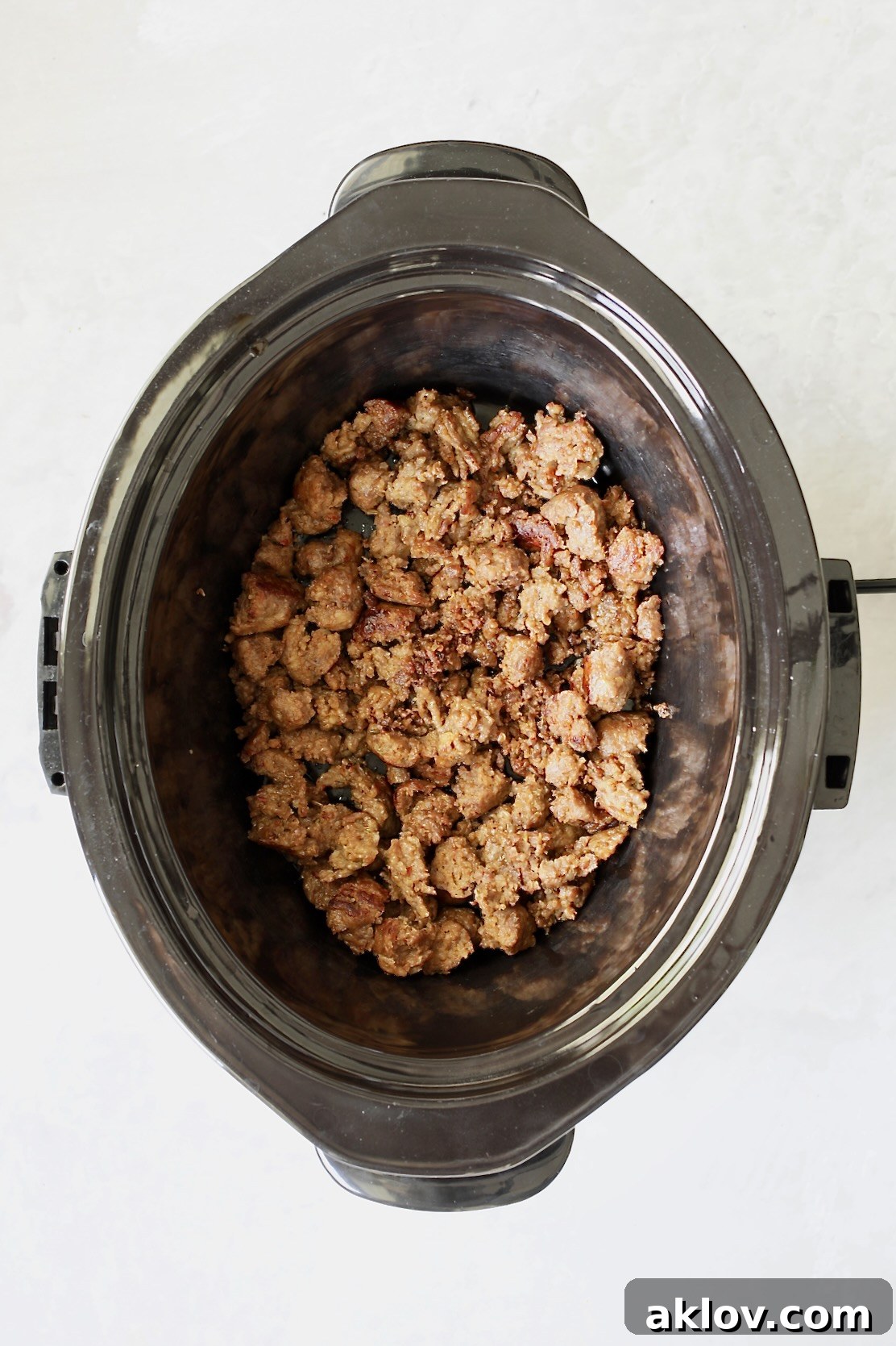 Cooked Italian sausage in slow cooker.