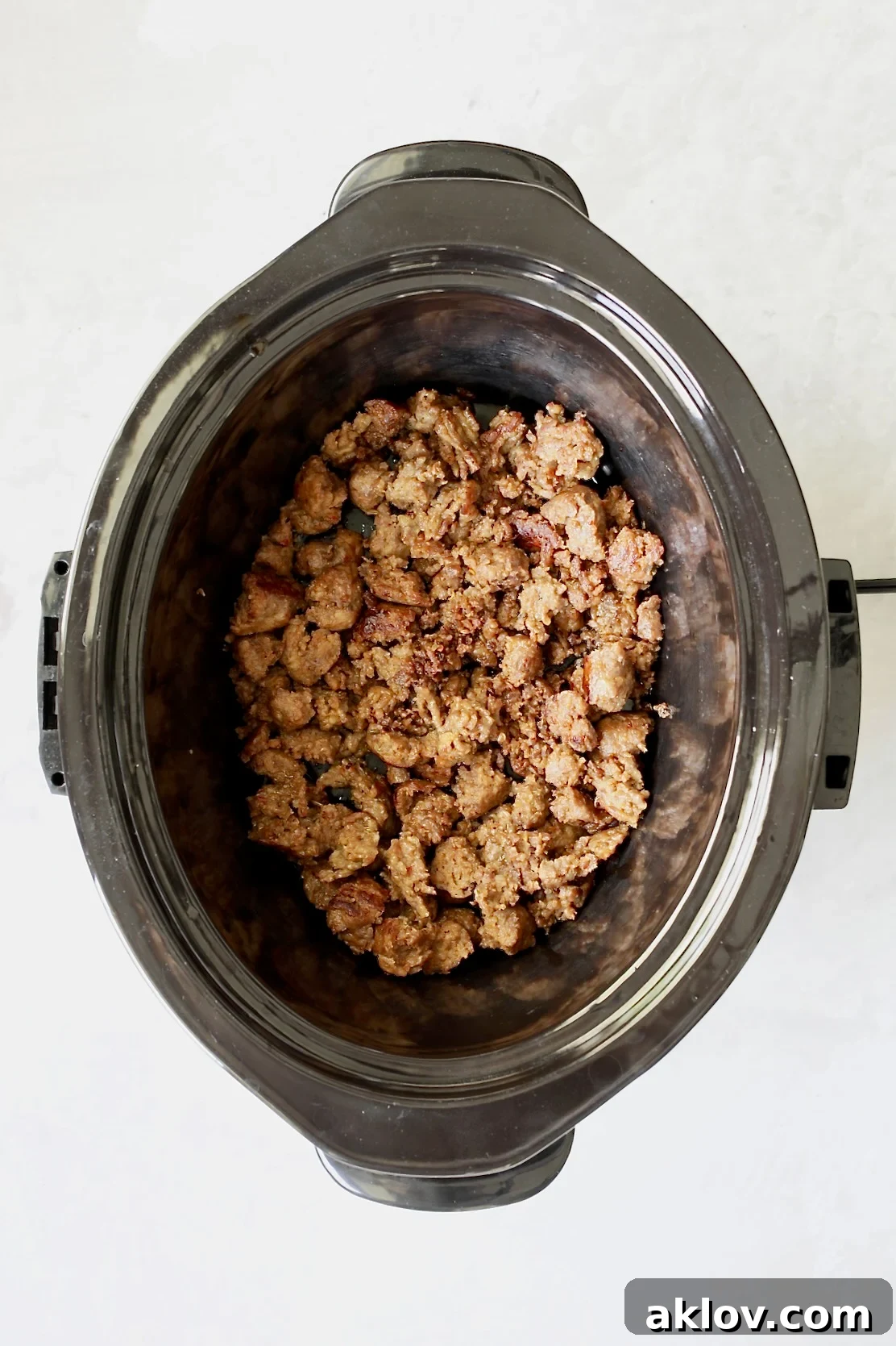 Cooked Italian sausage in slow cooker.