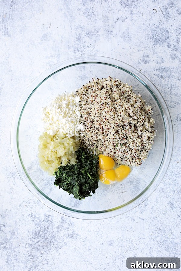 Photo of quinoa cake ingredients in glass bowl.