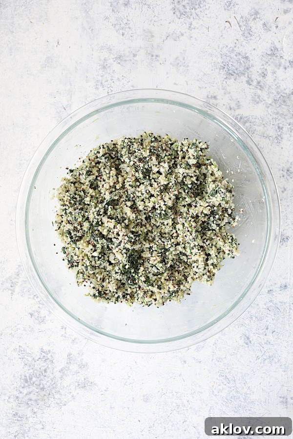 Photo of quinoa cake ingredients combined in glass bowl.