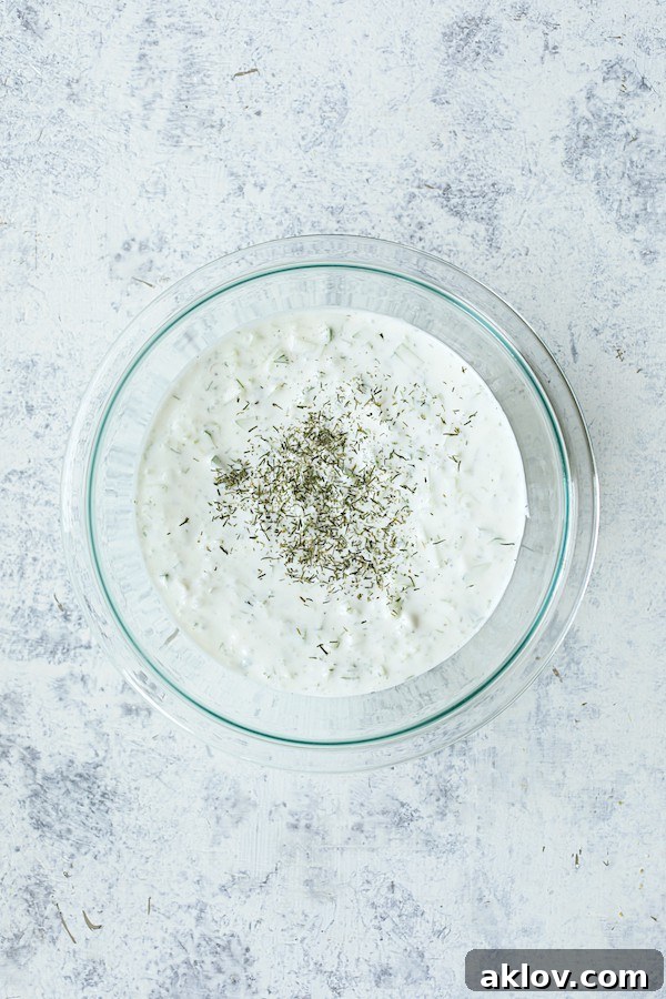 Photo of tzatziki sauce in glass bowl.