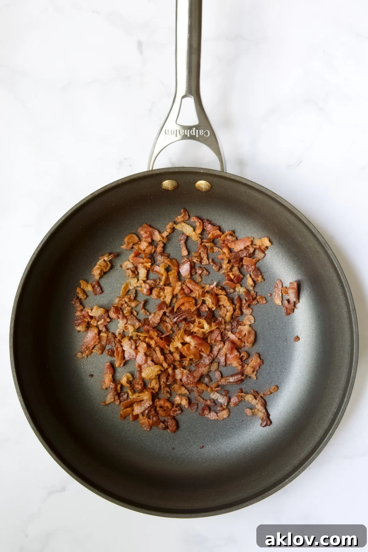 Cooked bacon in nonstick skillet.
