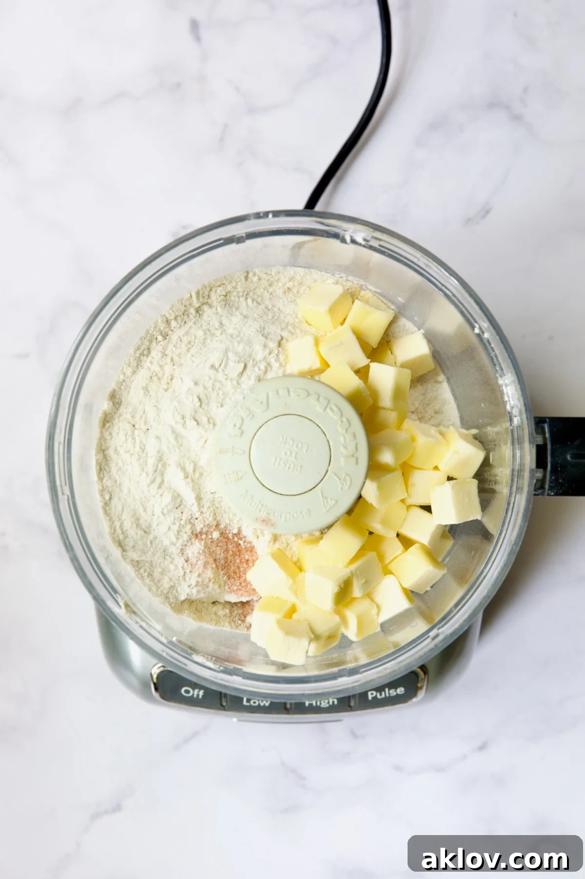 Flour, butter cubes and salt in food processor before being incorporated.