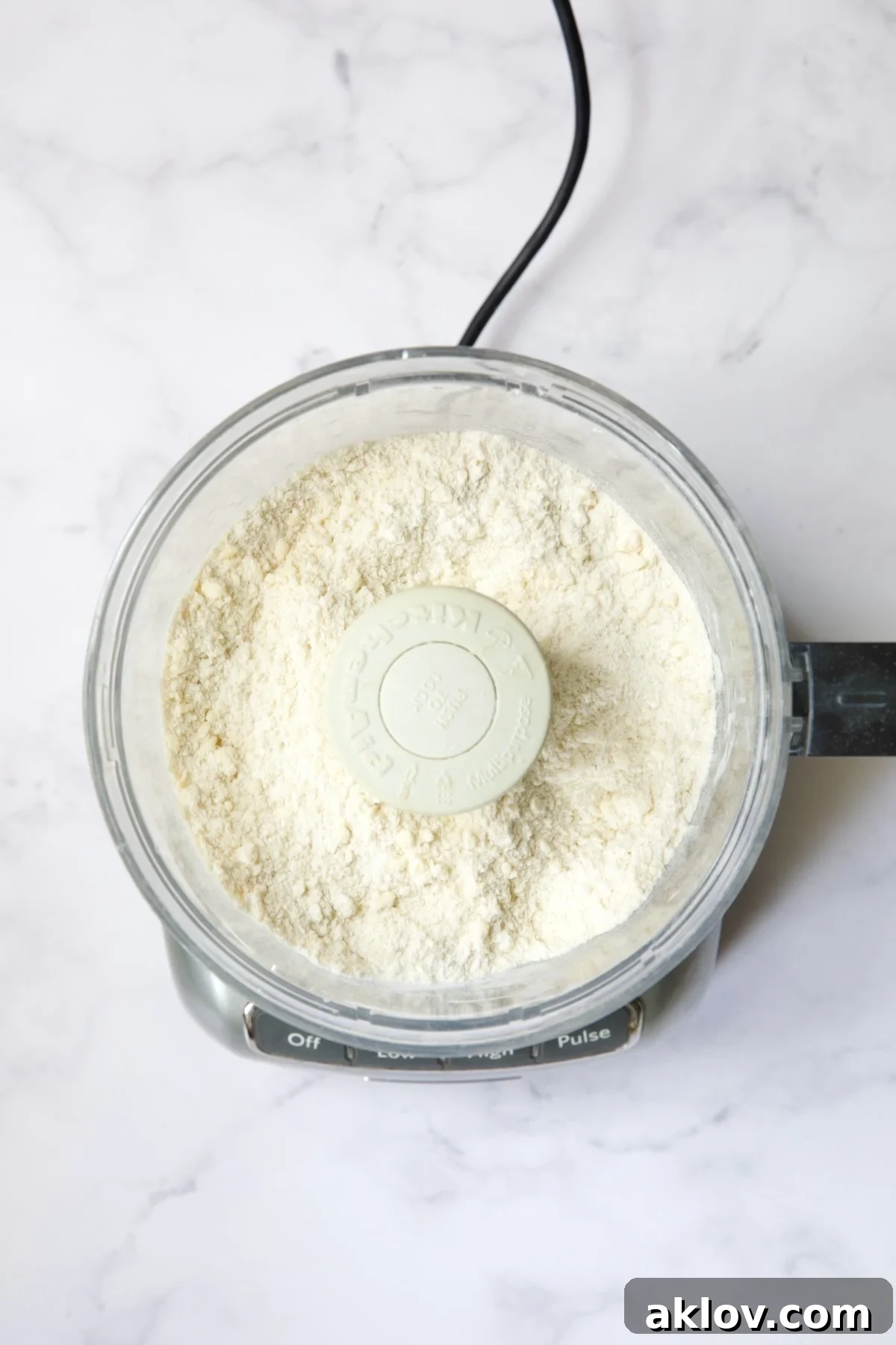 Ingredients for galette dough in food processor after butter is incorporated.