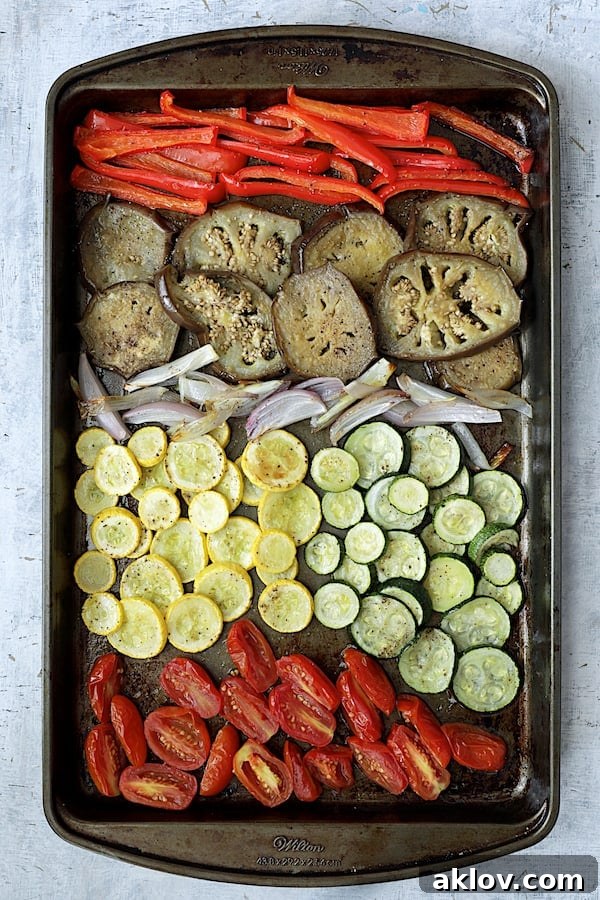 Photo of roasted vegetables on baking sheet.