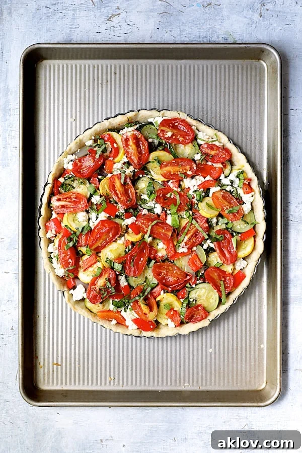 Photo of vegetable-filled tart pan before being baked.