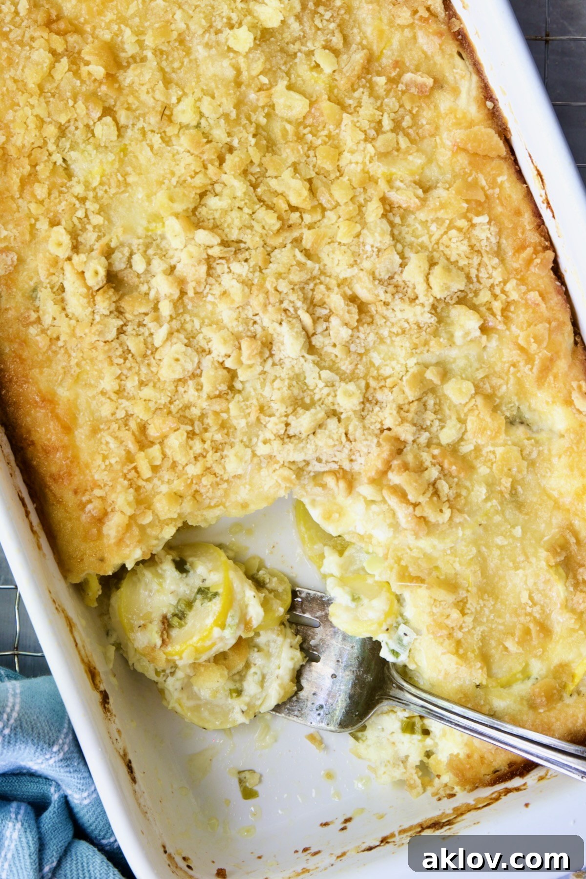 Summer Squash Casserole with a piece removed and squash on serving fork.