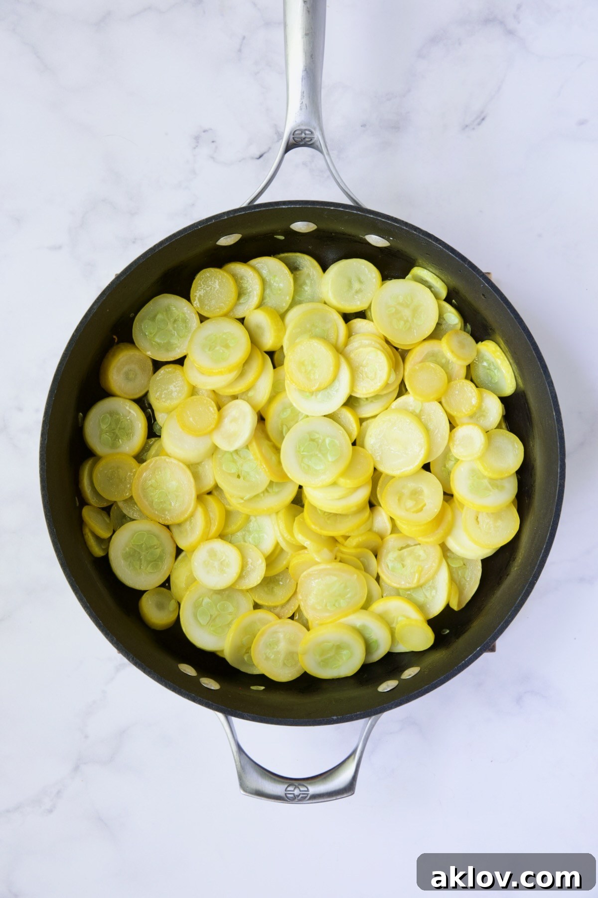 Cooked yellow squash in nonstick skillet.