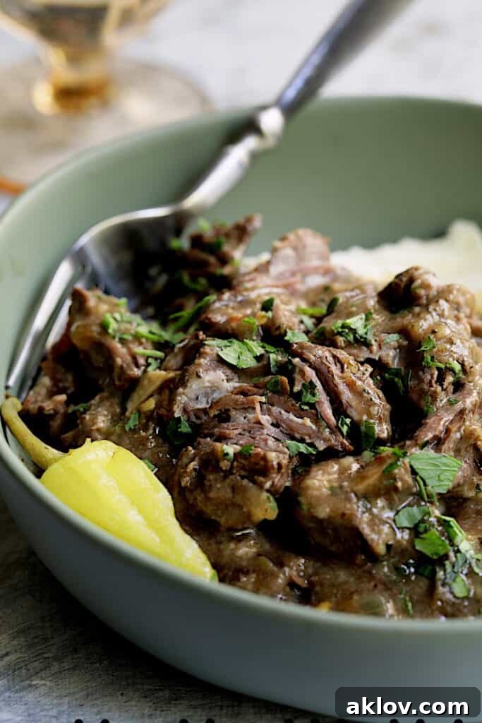 Close-up photo of Mississippi-Style Boneless Beef Short Ribs in green bowl.