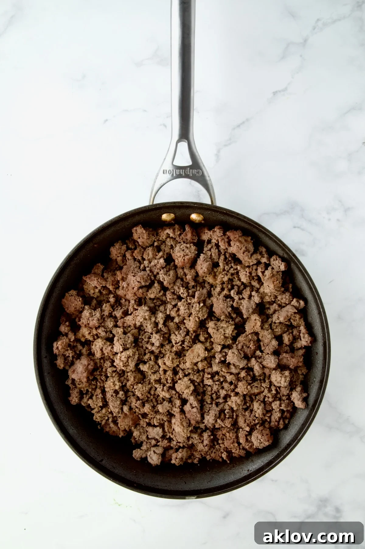 Browned ground beef in nonstick skillet.