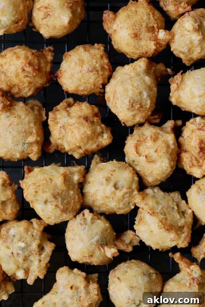 Close-up photo of fried beignets, highlighting their golden crisp texture.