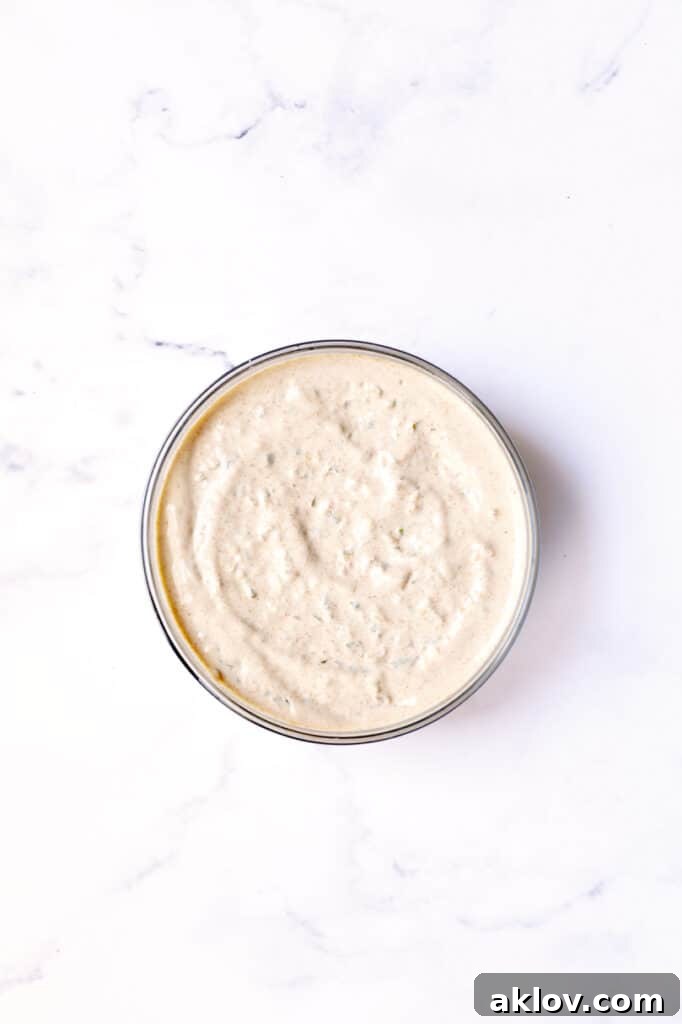 Photo of perfectly blended Jalapeno Remoulade in a clear glass bowl, ready for serving.