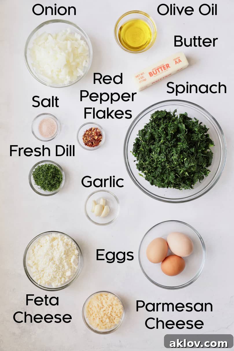 Skillet Spanakopita with Spinach and Feta 4 Overhead shot of fresh ingredients for spanakopita, including spinach, feta, herbs, and onions. This image showcases the quality and freshness of the components.