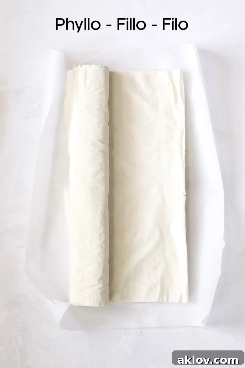 Skillet Spanakopita with Spinach and Feta 5 Overhead shot of delicate phyllo/fillo/filo dough sheets, neatly stacked and ready for use. This image emphasizes the key pastry component.