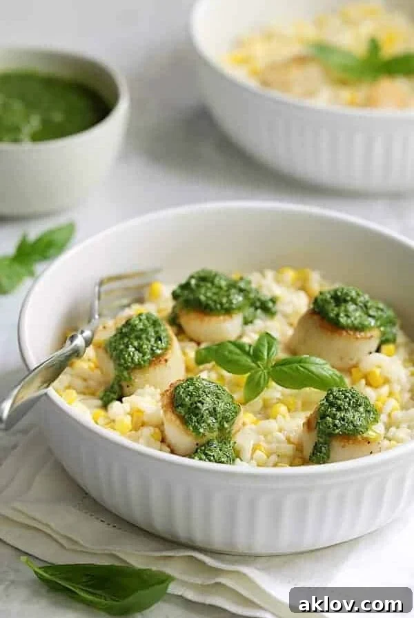 Seared Sea Scallops with Sweet Corn Risotto and Basil Salsa Verde in white bowl.