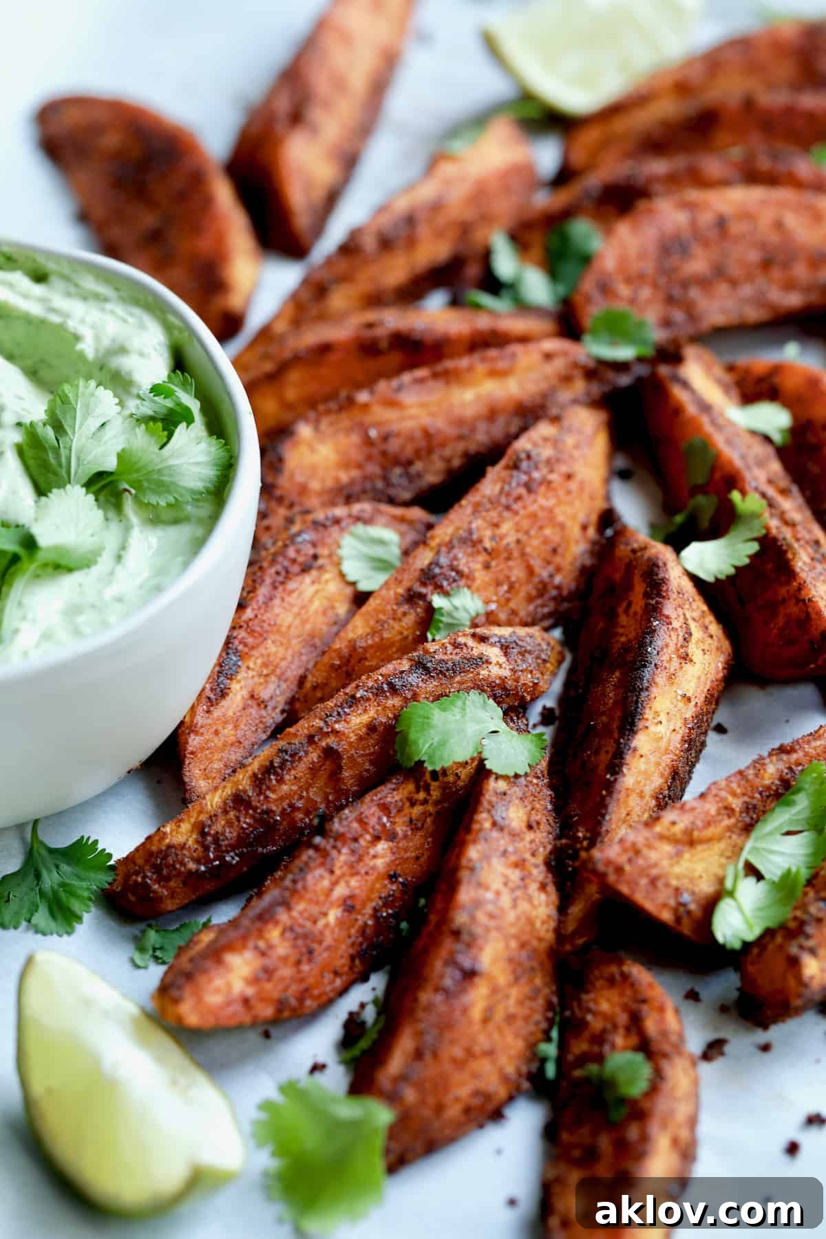 Southwestern Sweet Potato Wedges garnished with cilantro leaves.