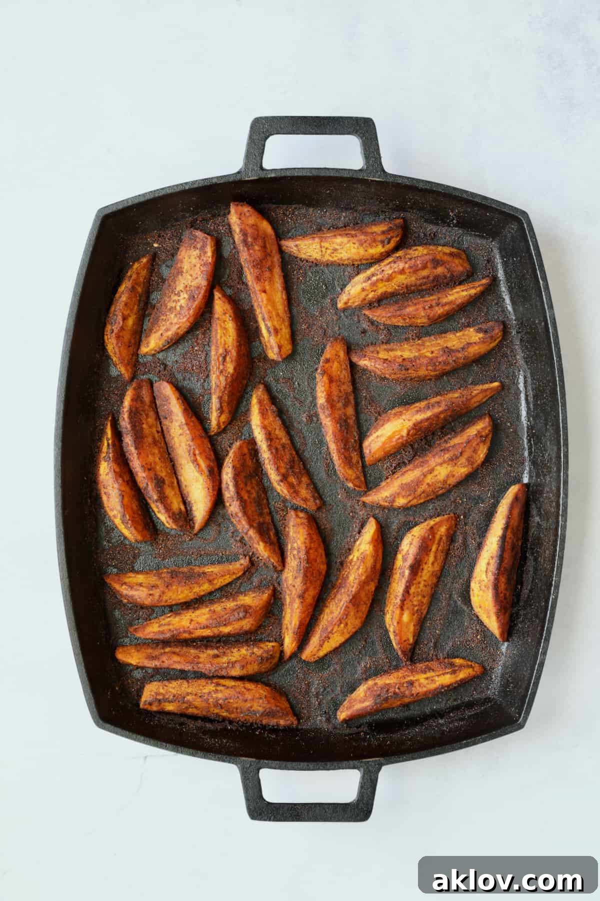 Southwestern Sweet Potato Wedges on cast iron pan after being roasted.