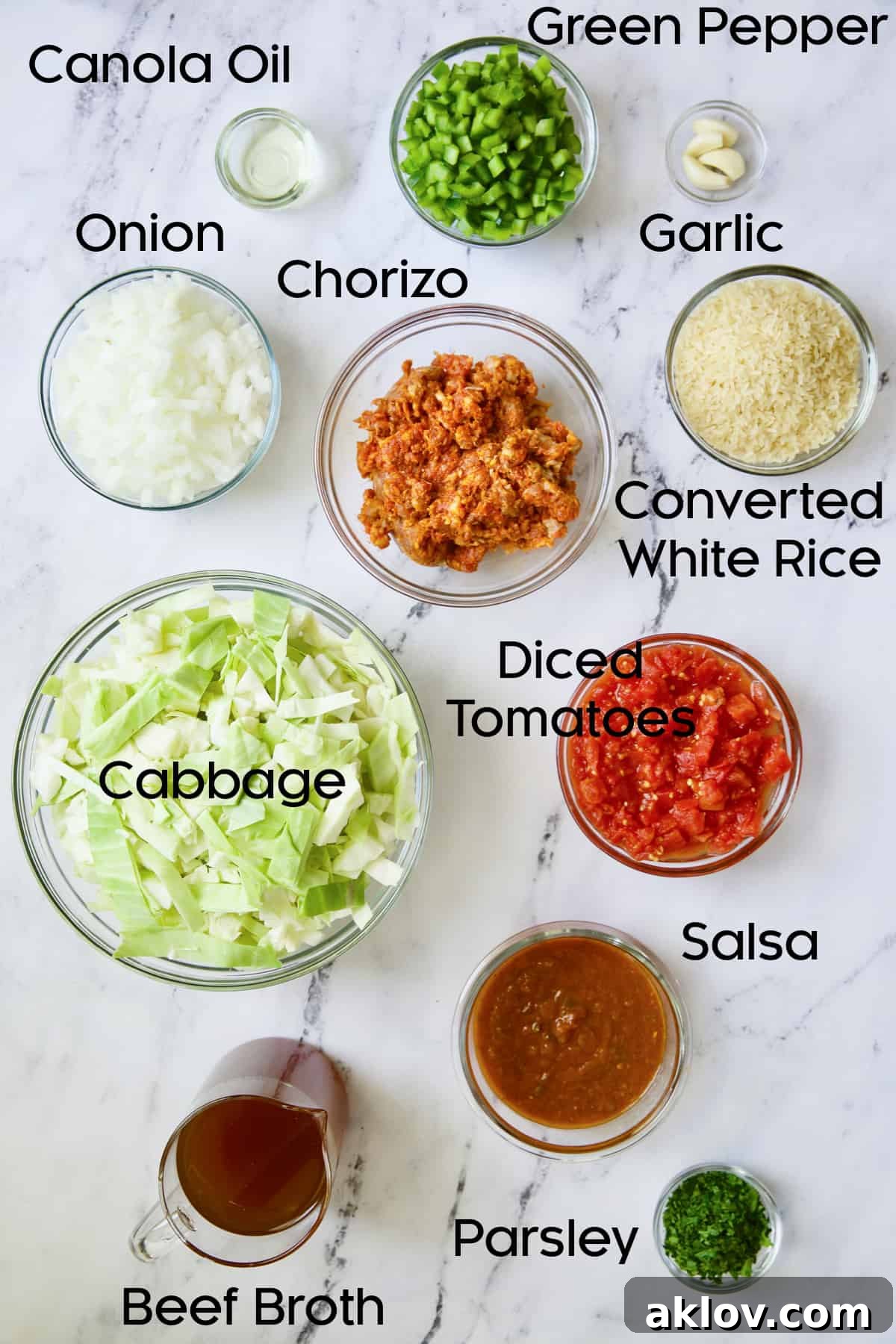 Assortment of ingredients for Unstuffed Chorizo Cabbage Roll Skillet neatly arranged in glass bowls.