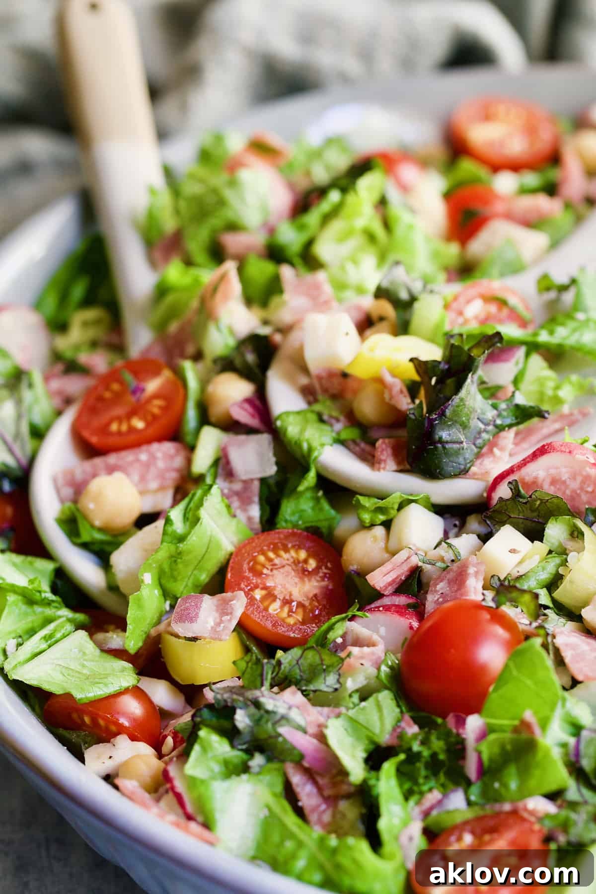 A top-down view of a colorful Italian Chopped Salad with Chicken, showcasing its fresh ingredients.