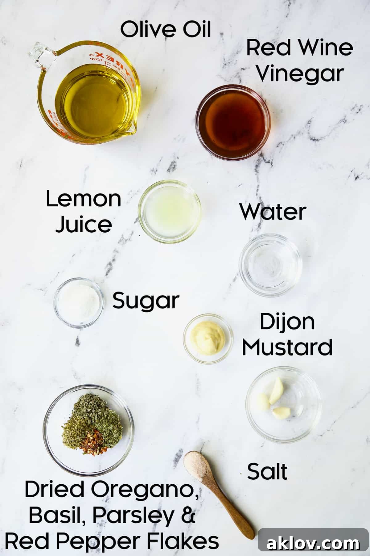 Various dressing ingredients for Italian Chopped Salad with Chicken arranged in glass bowls.