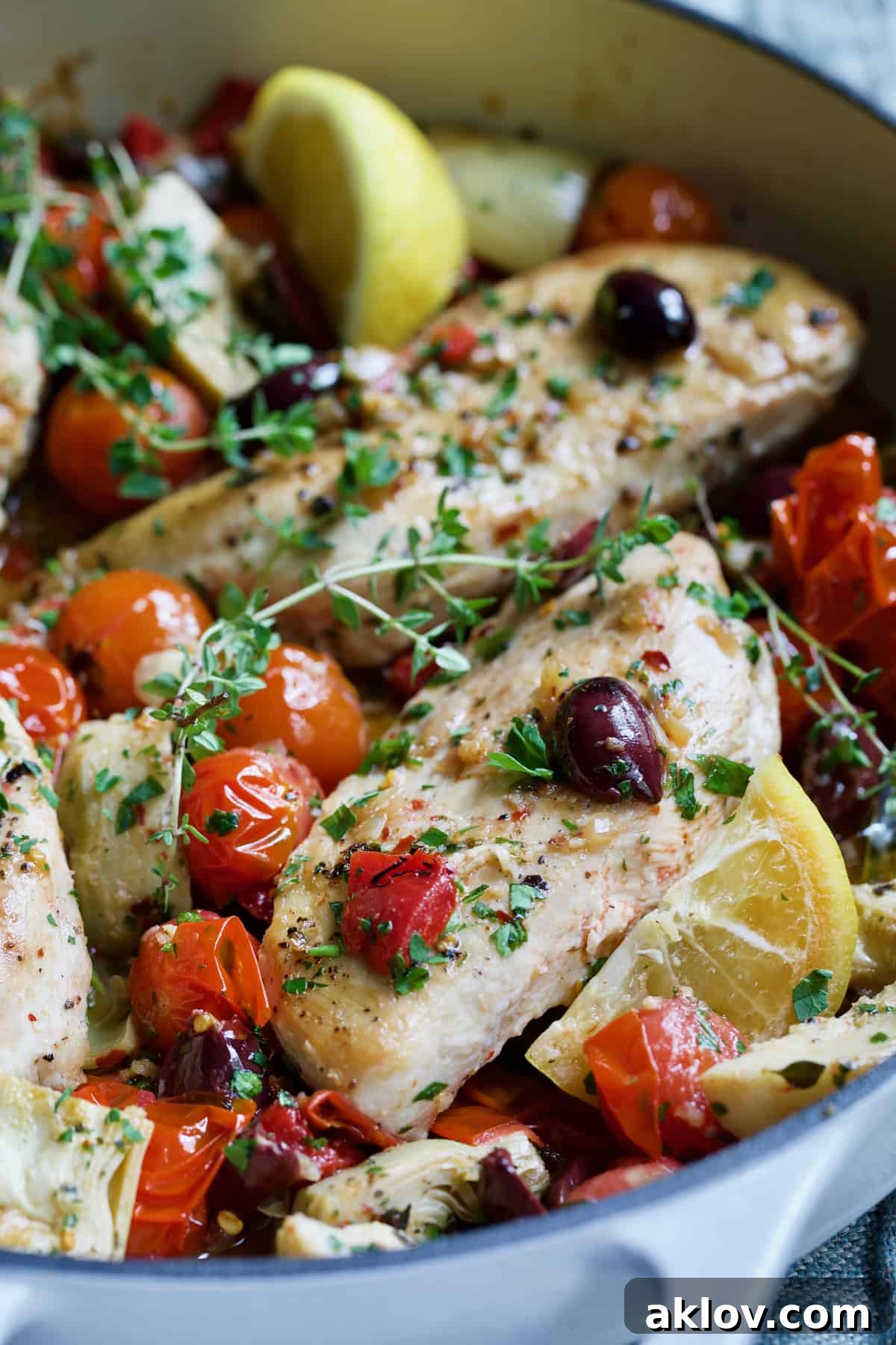 Two of the chicken breasts in Easy Skillet Mediterranean Chicken.