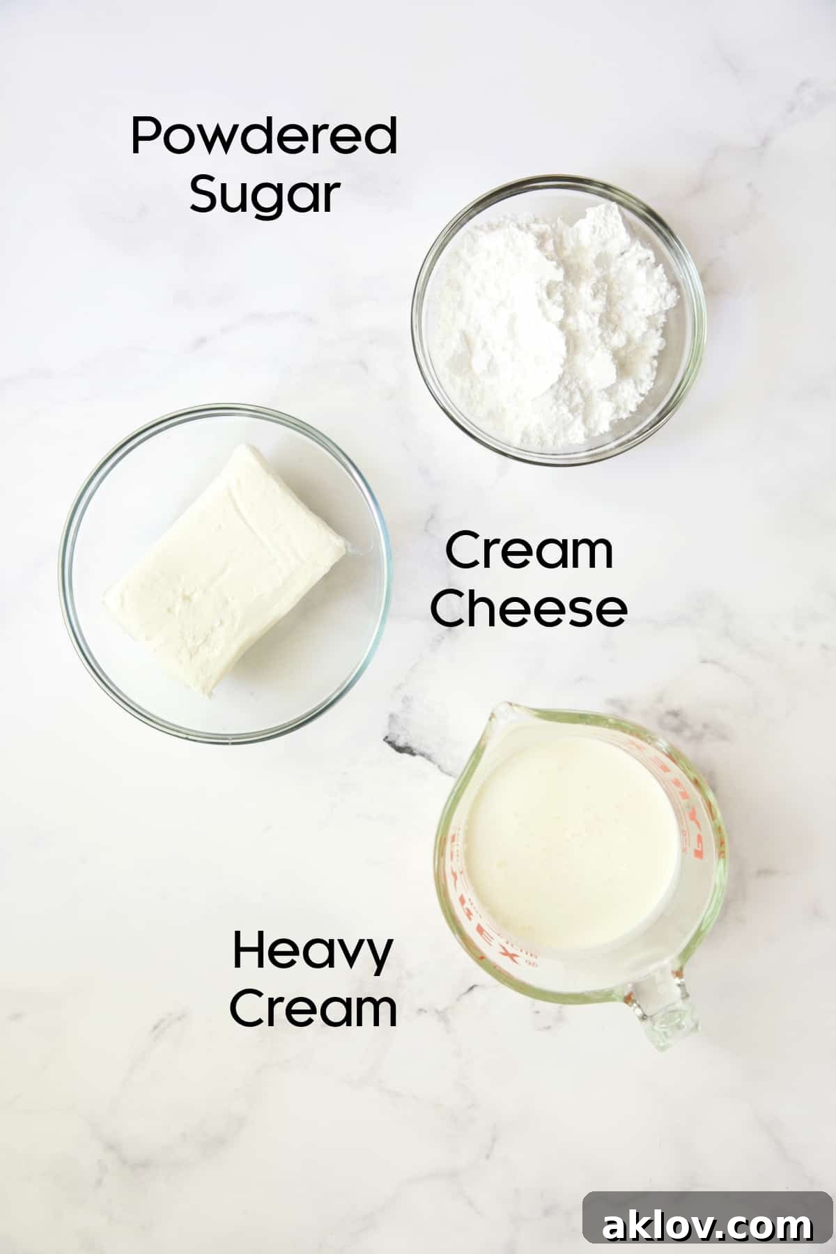Photo of ingredients for cream cheese layer in glass bowls.