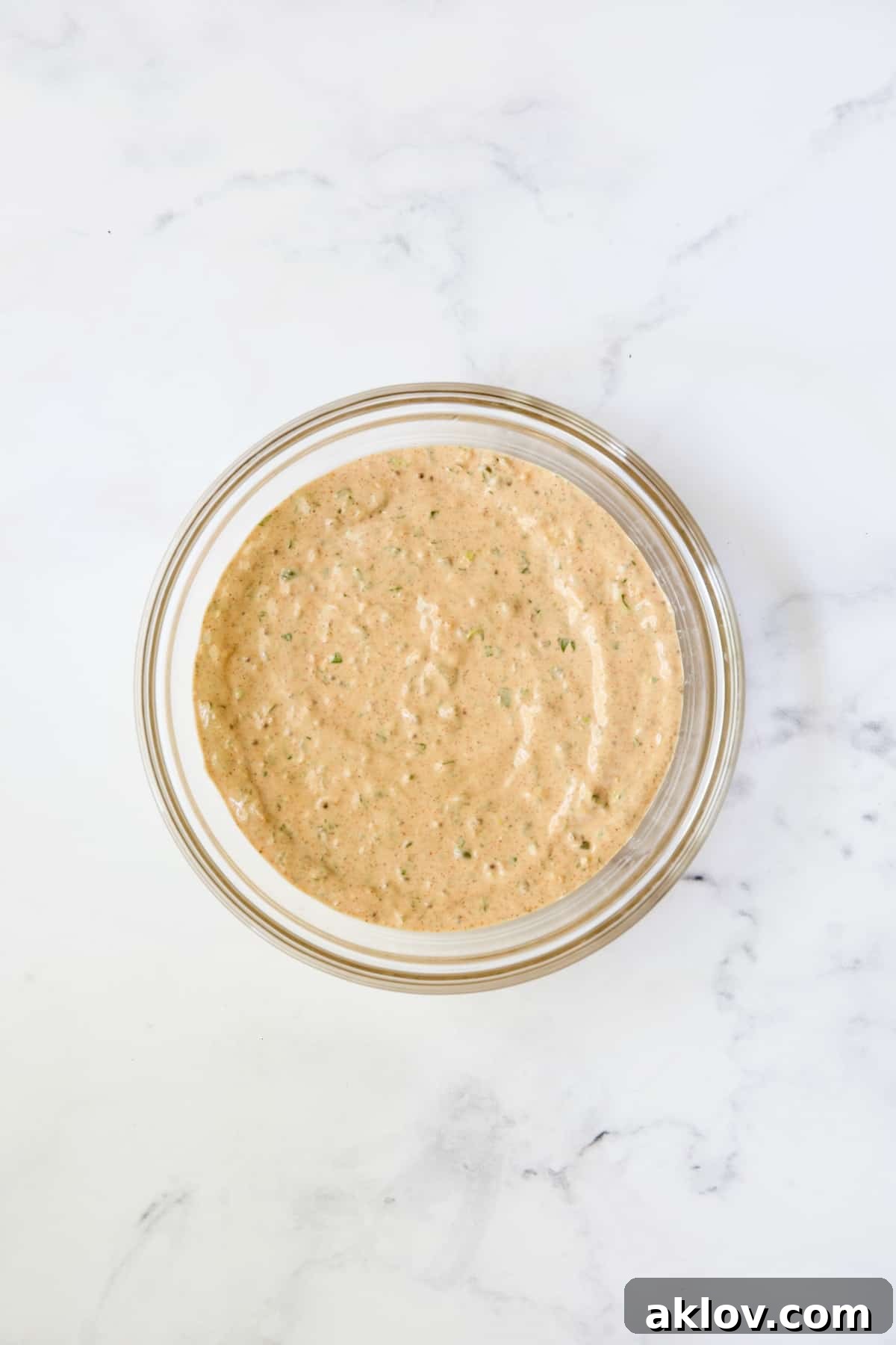 Sriracha remoulade in glass bowl.