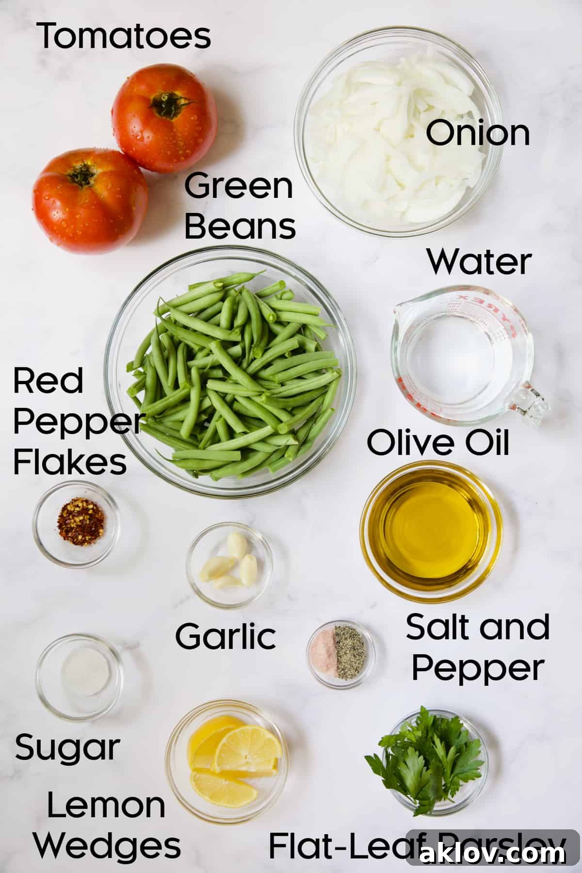 Mediterranean Green Bean and Tomato Stew 4 Ingredients for Mediterranean Braised Green Beans with Tomatoes in glass bowls.