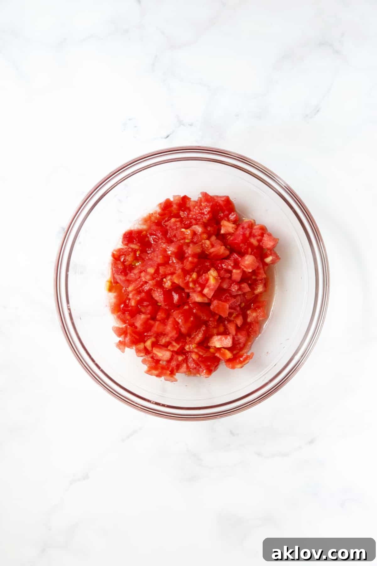 Mediterranean Green Bean and Tomato Stew 7 Diced tomatoes in glass bowl.