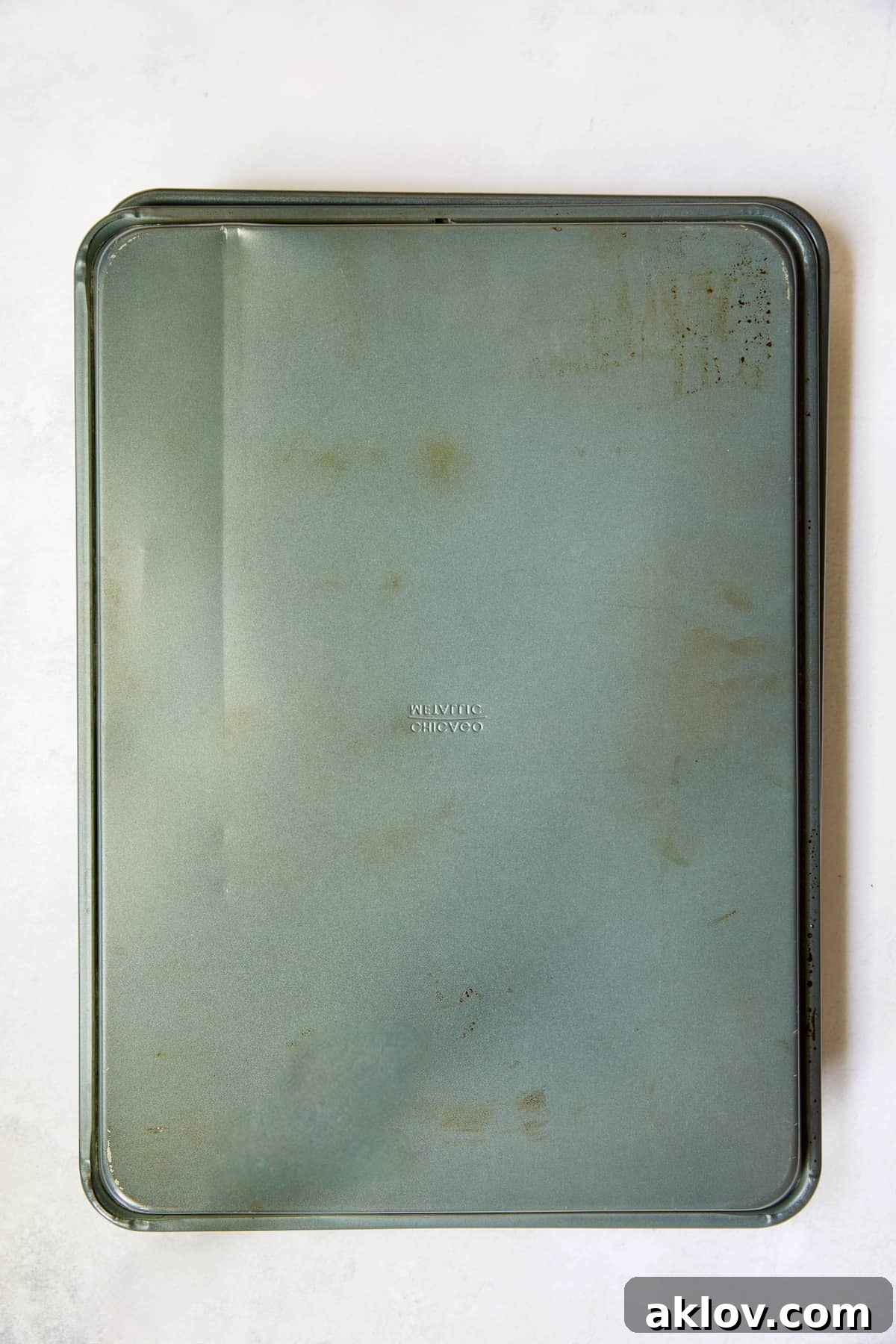 Hatch Green Chiles: Roast and Freeze for Year-Round Enjoyment 8 Two sheet pans, with one inverted and placed over the other to steam roasted Hatch green chiles.