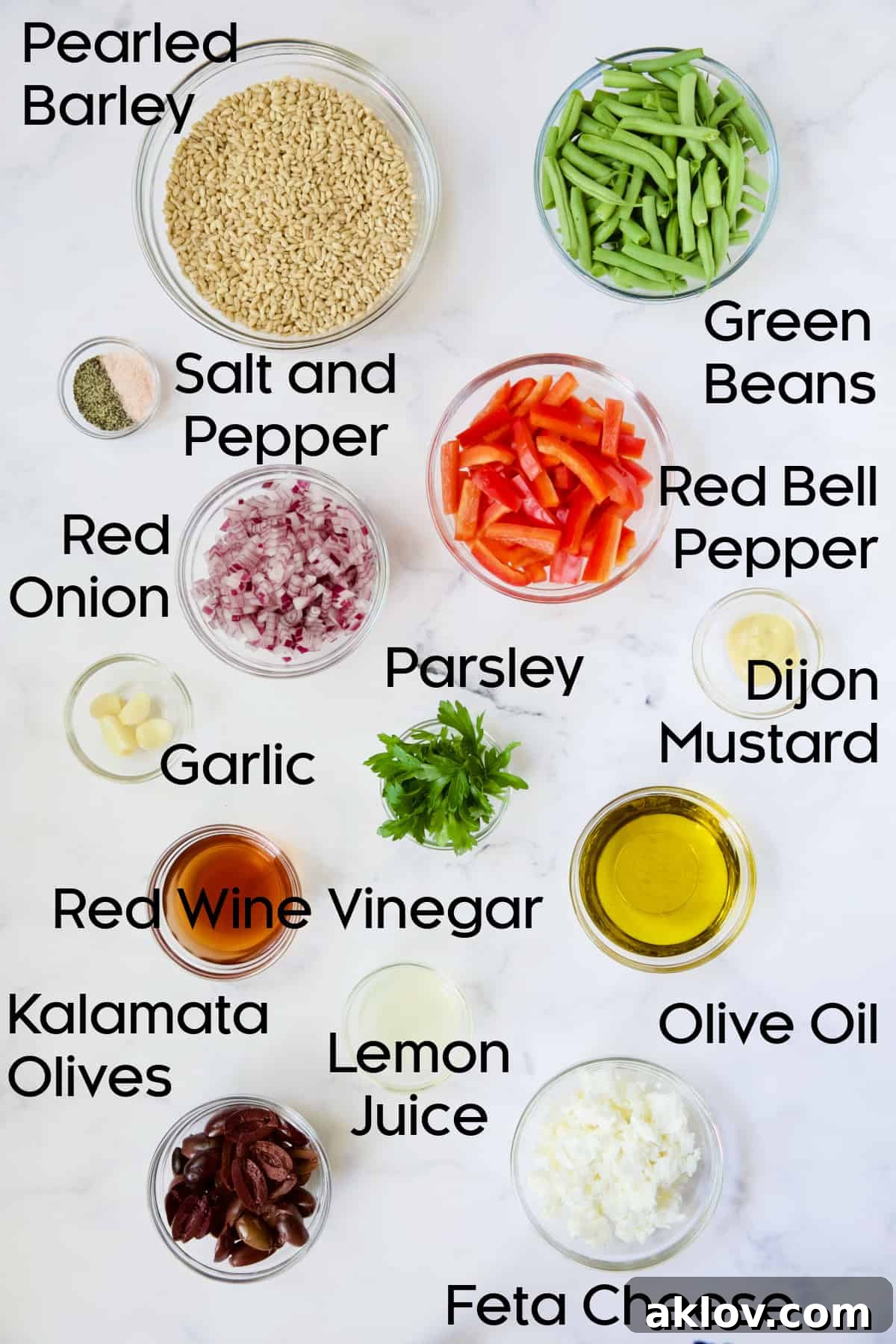 Ingredients for Mediterranean Barley Salad in glass bowls.
