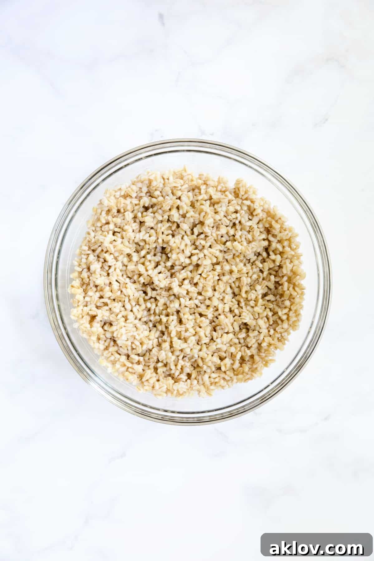Cooked barley in glass bowl.